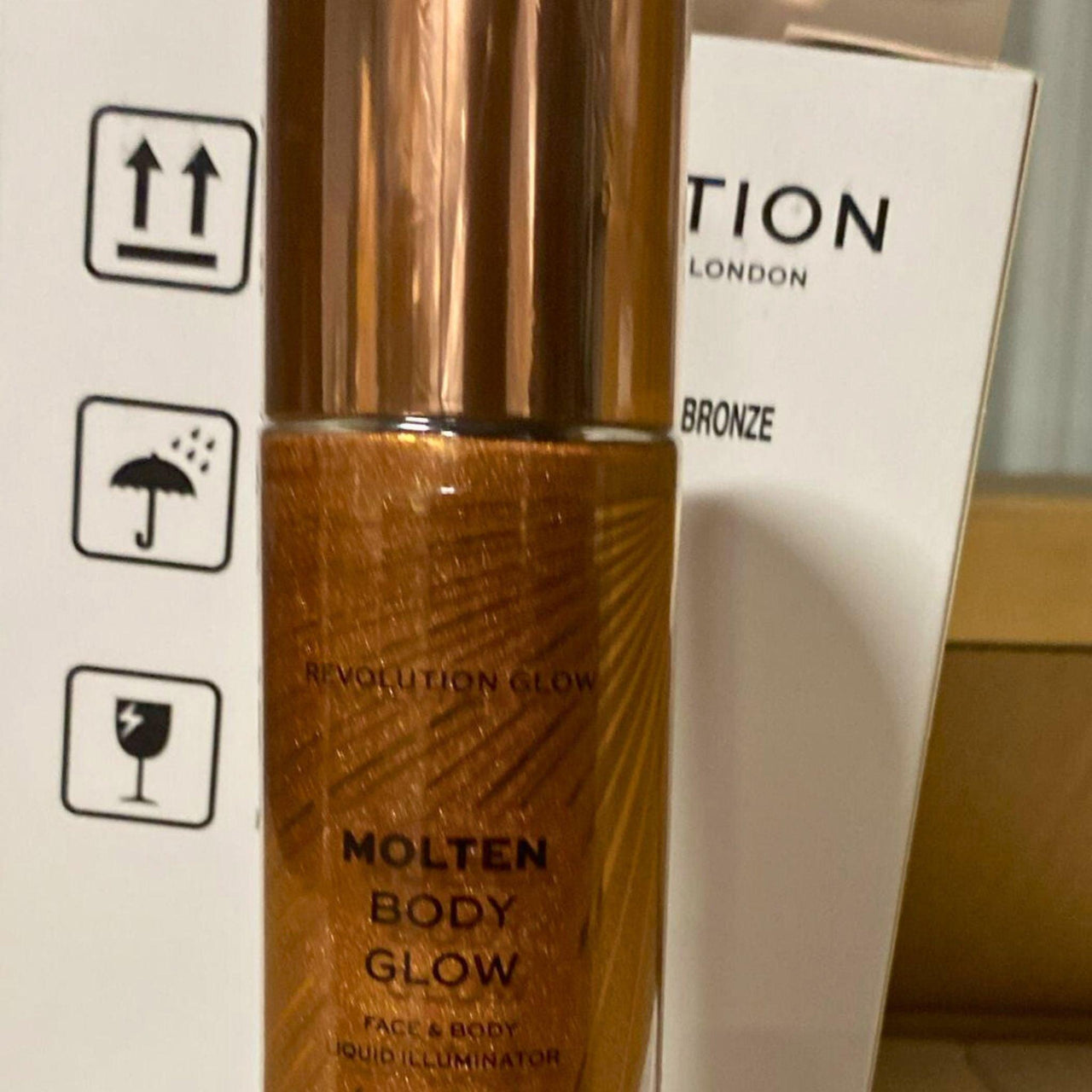 Revolution Molten Body GLow Face & Body Liquid Illuminator Bronze 3.38OZ (36 Pcs Lot) - Discount Wholesalers Inc